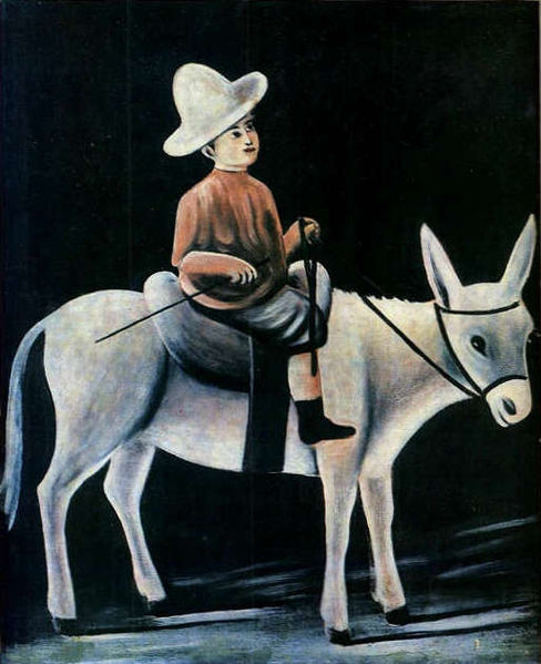 A Little Boy Riding a Donkey